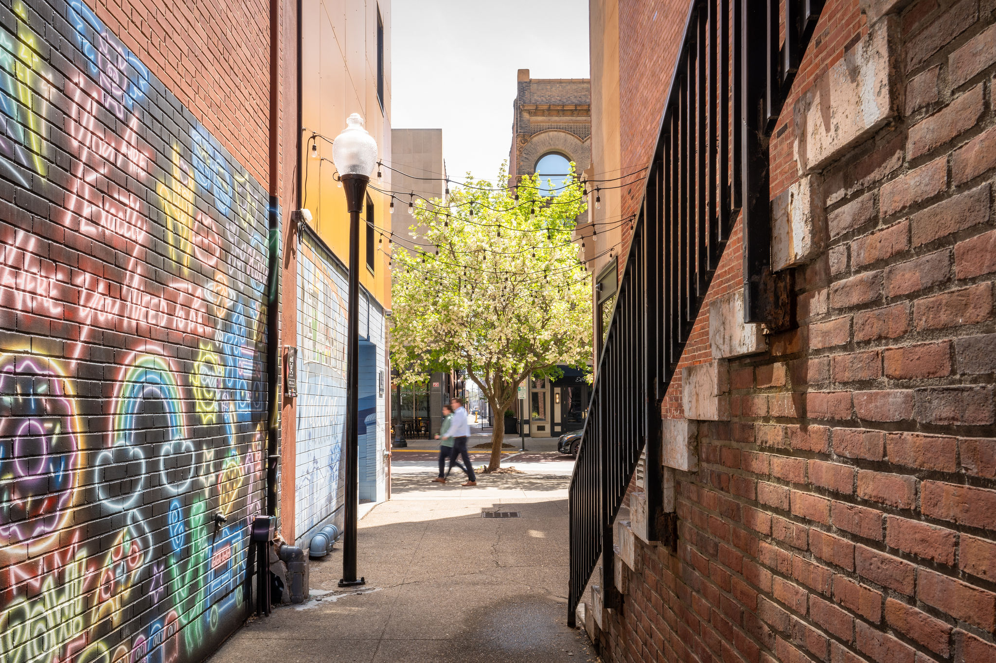 Downtown Evansville alleyway with street art and string lights